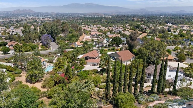 10750 Orchard View Ln, Riverside, CA 92503 - aerial view of property and surrounding area featuring a mountain backdrop and nearby suburban area