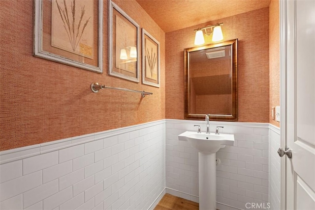 104 Working, Irvine, CA 92602 - bathroom featuring a wainscoted wall, a sink, and tile walls