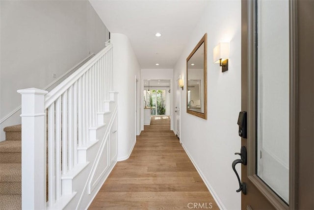 104 Working, Irvine, CA 92602 - corridor with light wood-style floors, stairway, recessed lighting, and baseboards
