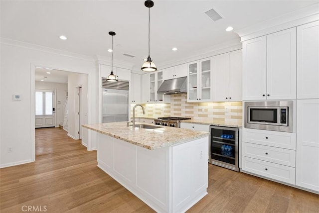 104 Working, Irvine, CA 92602 - kitchen featuring beverage cooler, a sink, built in appliances, under cabinet range hood, and light wood finished floors