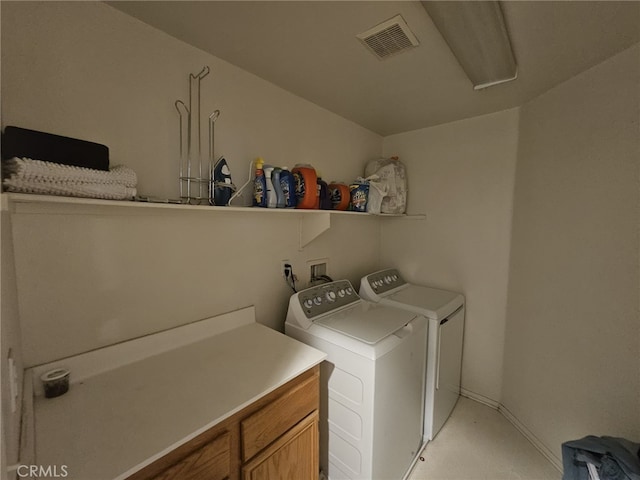 12912 Newport St, Hesperia, CA 92344 - washroom with washer and clothes dryer and cabinet space