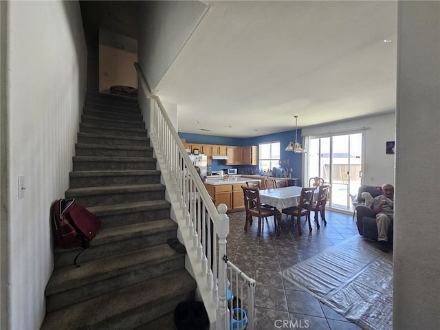 12912 Newport St, Hesperia, CA 92344 - stairs featuring a chandelier