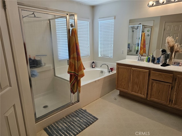 12912 Newport St, Hesperia, CA 92344 - bathroom featuring vanity, a stall shower, a bath, and tile patterned floors