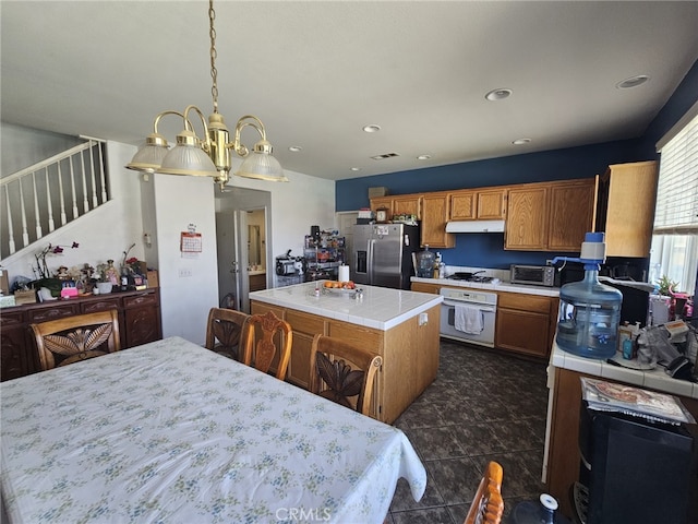 12912 Newport St, Hesperia, CA 92344 - kitchen with white appliances, tile countertops, under cabinet range hood, a center island, and recessed lighting
