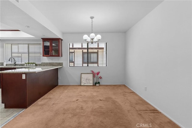 17117 S Vermont Ave Unit 132, Gardena, CA 90247 - dining room with a chandelier, plenty of natural light, light carpet, and baseboards