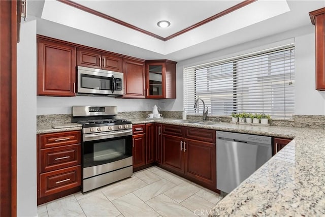 17117 S Vermont Ave Unit 132, Gardena, CA 90247 - kitchen featuring stainless steel appliances, a sink, dark brown cabinets, a raised ceiling, and ornamental molding