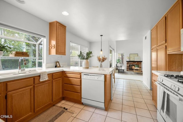 15254 Alyssas Ct, Moorpark, CA 93021 - kitchen featuring white appliances, a sink, light tile patterned floors, a peninsula, and open floor plan