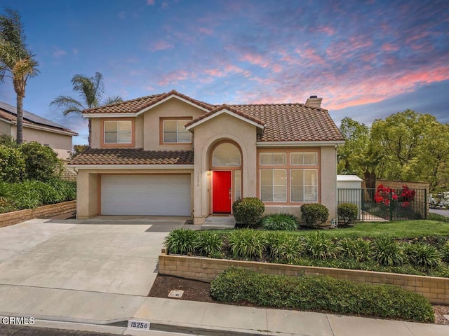 15254 Alyssas Ct, Moorpark, CA 93021 - view of front of house with a tile roof, stucco siding, driveway, and a chimney