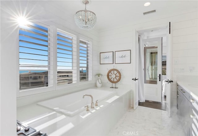 101 Via Almodovar, San Clemente, CA 92672 - bathroom featuring a garden tub, a chandelier, vanity, and marble finish floors