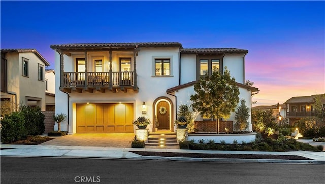 101 Via Almodovar, San Clemente, CA 92672 - mediterranean / spanish-style home featuring a balcony, an attached garage, decorative driveway, a tiled roof, and stucco siding