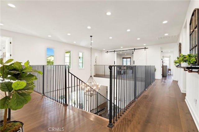 101 Via Almodovar, San Clemente, CA 92672 - hall featuring recessed lighting, wood-type flooring, an upstairs landing, and baseboards