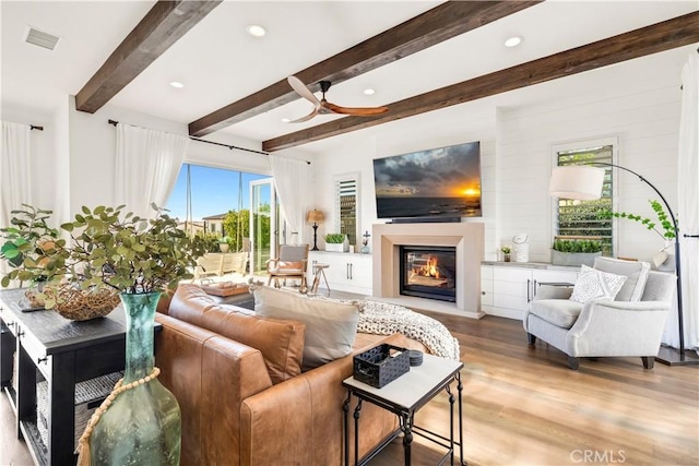 101 Via Almodovar, San Clemente, CA 92672 - living area with a glass covered fireplace, wood finished floors, beam ceiling, ceiling fan, and recessed lighting