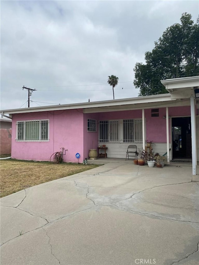 1713 W 165th St, Compton, CA 90220 - view of front of house featuring stucco siding and a front yard