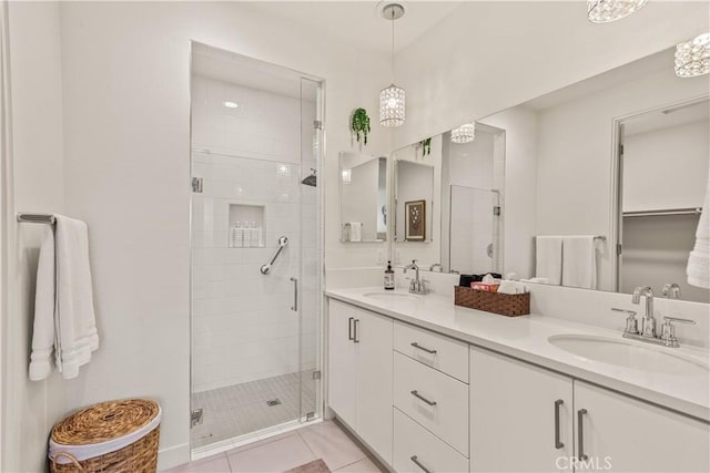 80281 Redstone Way, La Quinta, CA 92253 - bathroom with a stall shower, double vanity, and tile patterned flooring