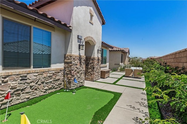 80281 Redstone Way, La Quinta, CA 92253 - view of yard featuring a patio and an area to practice putting
