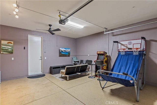 80281 Redstone Way, La Quinta, CA 92253 - garage featuring a garage door opener and a ceiling fan