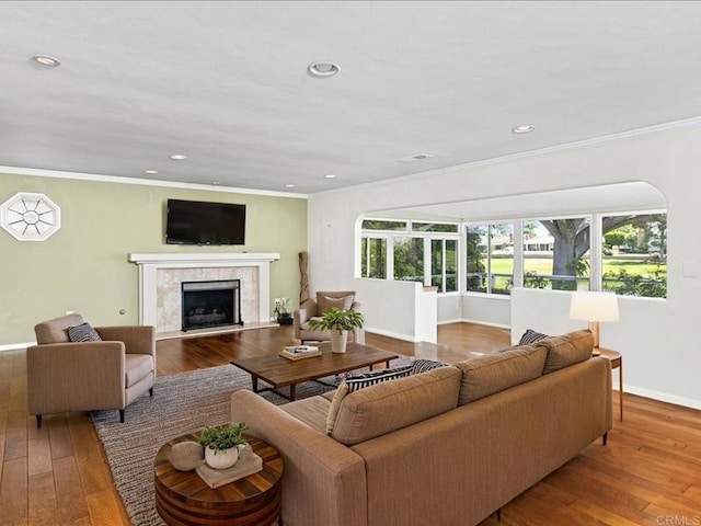 1051 La Reina, San Marcos, CA 92078 - living room with ornamental molding, baseboards, hardwood / wood-style floors, a high end fireplace, and recessed lighting