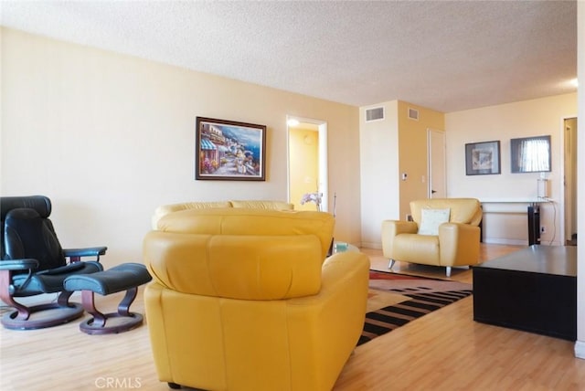 570 W Stocker St Unit 202, Glendale, CA 91202 - living room with wood finished floors and a textured ceiling