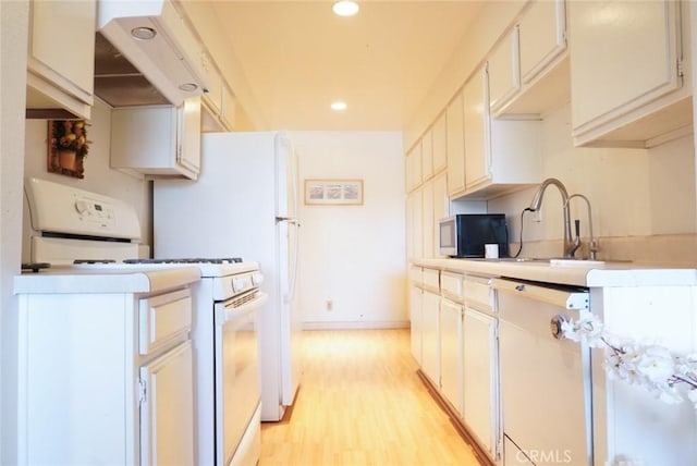 570 W Stocker St Unit 202, Glendale, CA 91202 - kitchen with white range with gas cooktop, stainless steel microwave, light wood finished floors, recessed lighting, and under cabinet range hood