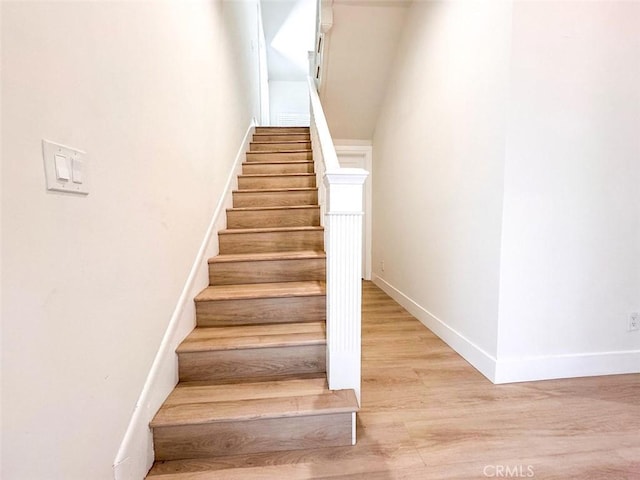 1051 W 18th St, Los Angeles, CA 90015 - staircase featuring baseboards and wood finished floors