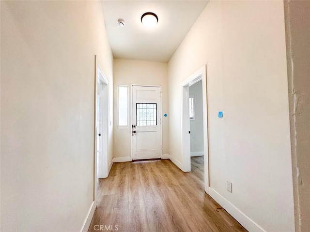 1051 W 18th St, Los Angeles, CA 90015 - doorway with light wood-type flooring and baseboards