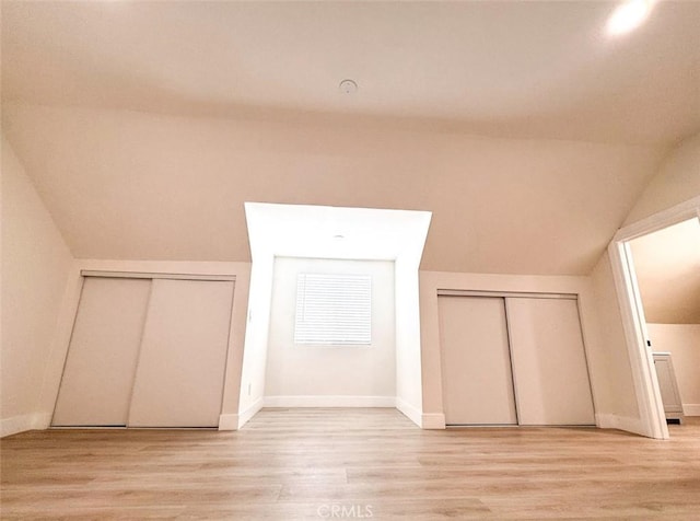 1051 W 18th St, Los Angeles, CA 90015 - bonus room with light wood-style floors, vaulted ceiling, and baseboards