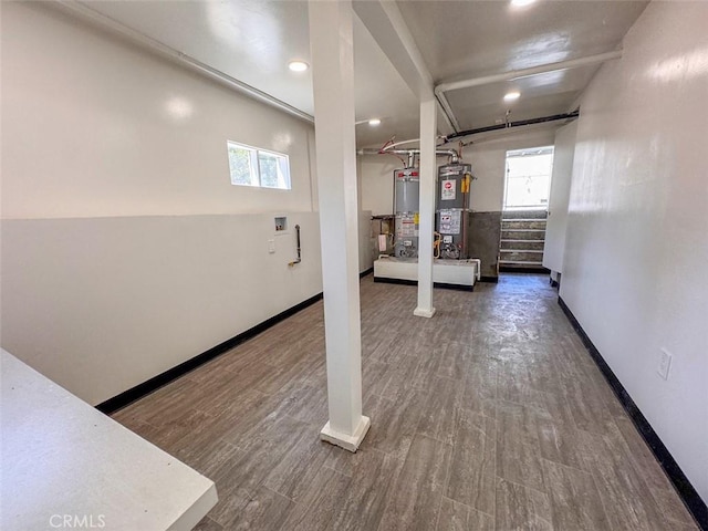 1051 W 18th St, Los Angeles, CA 90015 - basement featuring plenty of natural light, baseboards, and water heater