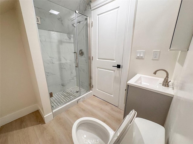 1051 W 18th St, Los Angeles, CA 90015 - bathroom featuring toilet, wood finished floors, and a marble finish shower
