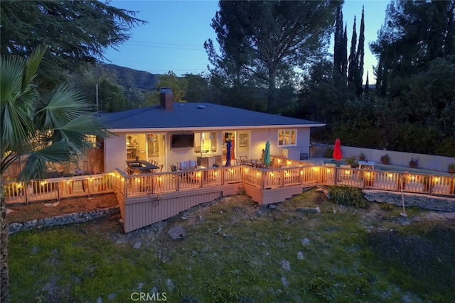 7235 Estepa Dr, Tujunga, CA 91042 - back of house featuring a chimney and a wooden deck