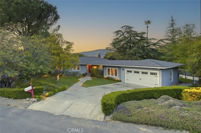 7235 Estepa Dr, Tujunga, CA 91042 - ranch-style home featuring an attached garage, a chimney, and concrete driveway