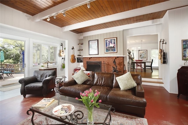 7235 Estepa Dr, Tujunga, CA 91042 - living area featuring track lighting, wood ceiling with exposed beams, and a brick fireplace