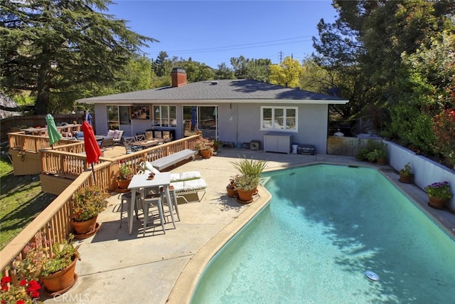 7235 Estepa Dr, Tujunga, CA 91042 - back of house with a deck, a chimney, stucco siding, a patio area, and roof with shingles