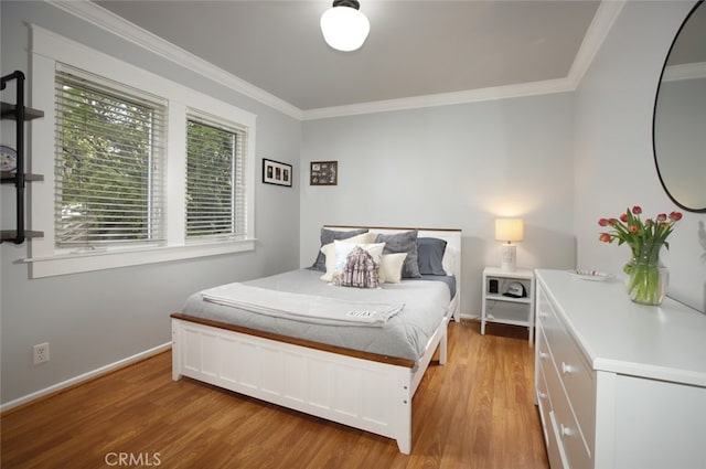 7235 Estepa Dr, Tujunga, CA 91042 - bedroom with crown molding, light wood finished floors, and baseboards