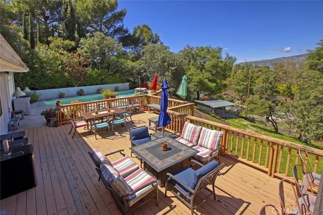 7235 Estepa Dr, Tujunga, CA 91042 - deck featuring outdoor dining space and a forest view