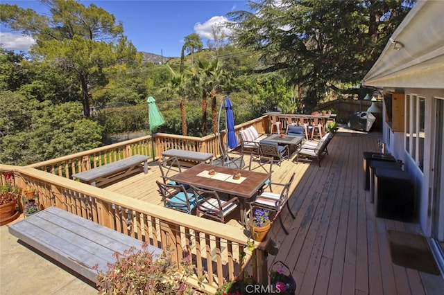 7235 Estepa Dr, Tujunga, CA 91042 - wooden terrace with outdoor dining area