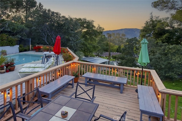7235 Estepa Dr, Tujunga, CA 91042 - wooden deck with outdoor dining area and a mountain view