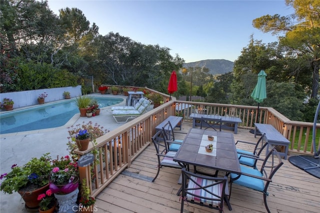 7235 Estepa Dr, Tujunga, CA 91042 - wooden deck with outdoor dining area and a mountain view