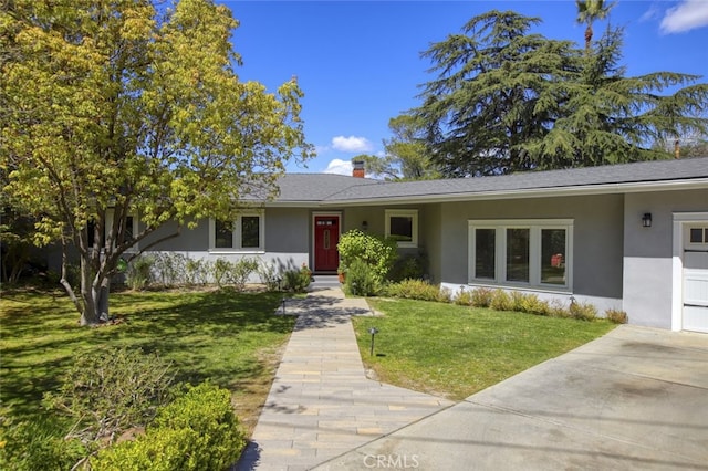 7235 Estepa Dr, Tujunga, CA 91042 - ranch-style home with stucco siding, a front yard, and a chimney