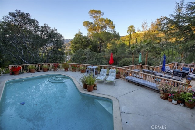 7235 Estepa Dr, Tujunga, CA 91042 - view of swimming pool featuring a deck with mountain view