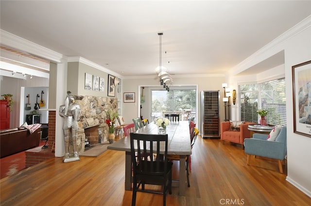 7235 Estepa Dr, Tujunga, CA 91042 - dining room with wine cooler, wood finished floors, and ornamental molding