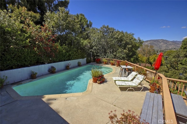7235 Estepa Dr, Tujunga, CA 91042 - view of swimming pool featuring a fenced backyard, a deck with mountain view, and a patio area