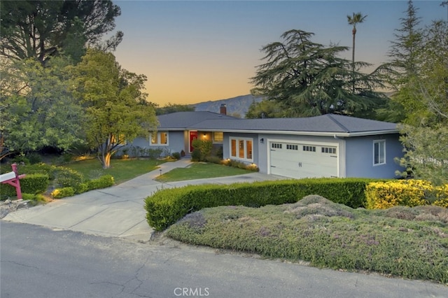 7235 Estepa Dr, Tujunga, CA 91042 - single story home featuring an attached garage, a front yard, a chimney, and stucco siding