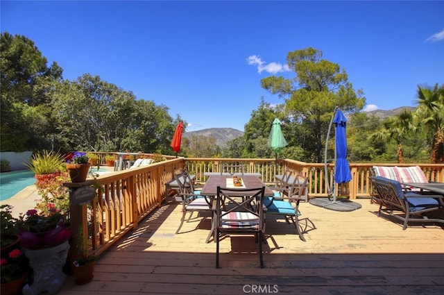 7235 Estepa Dr, Tujunga, CA 91042 - wooden terrace with outdoor dining space and a mountain view