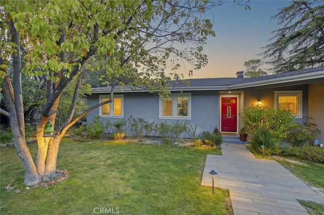 7235 Estepa Dr, Tujunga, CA 91042 - ranch-style home with stucco siding and a lawn