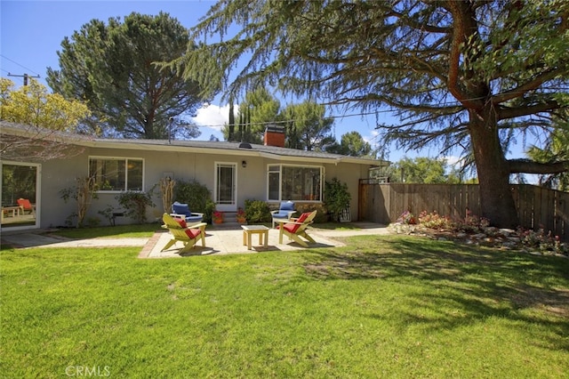 7235 Estepa Dr, Tujunga, CA 91042 - back of property featuring stucco siding, a chimney, and a patio area