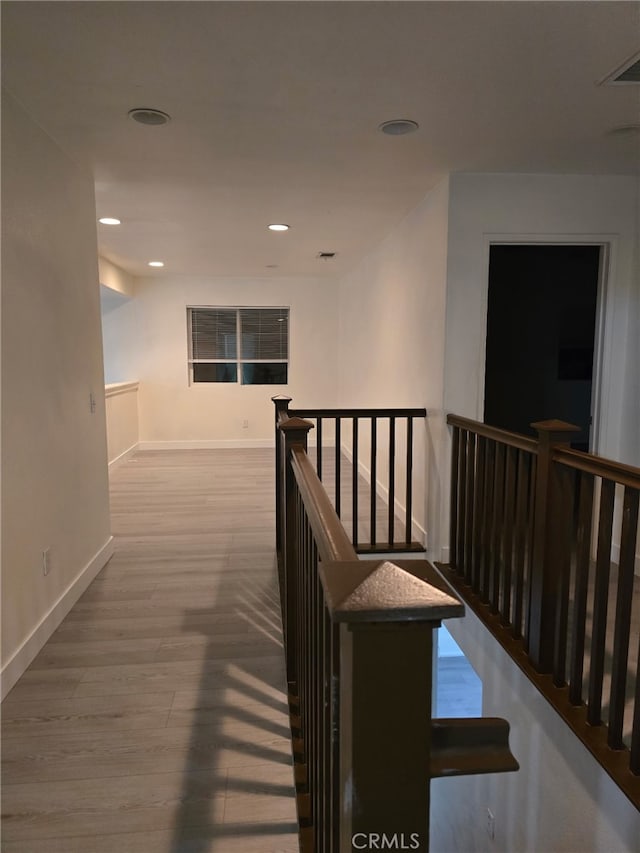 1416 Plaza Way, Perris, CA 92570 - hall with an upstairs landing, baseboards, wood finished floors, and recessed lighting
