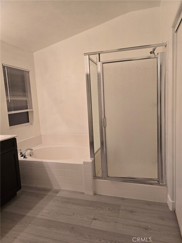 1416 Plaza Way, Perris, CA 92570 - bathroom featuring a stall shower, a bath, vanity, and wood finished floors