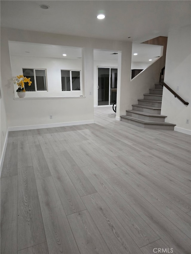 1416 Plaza Way, Perris, CA 92570 - unfurnished living room featuring stairway, wood finished floors, baseboards, and recessed lighting