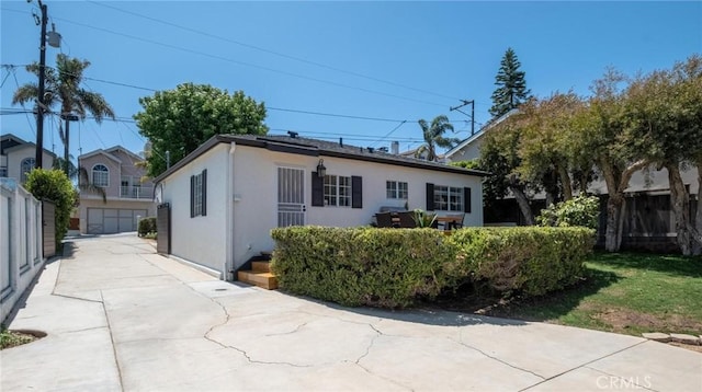1108 Stanford Ave, Redondo Beach, CA 90278 - view of front of house featuring an outbuilding, stucco siding, and concrete driveway