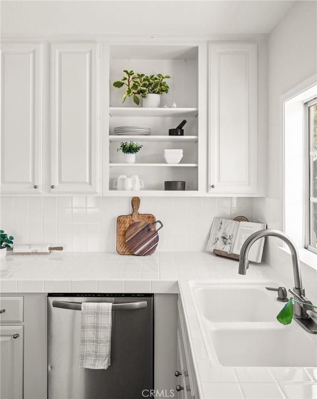 1108 Stanford Ave, Redondo Beach, CA 90278 - kitchen with a sink, dishwasher, white cabinetry, and tile countertops